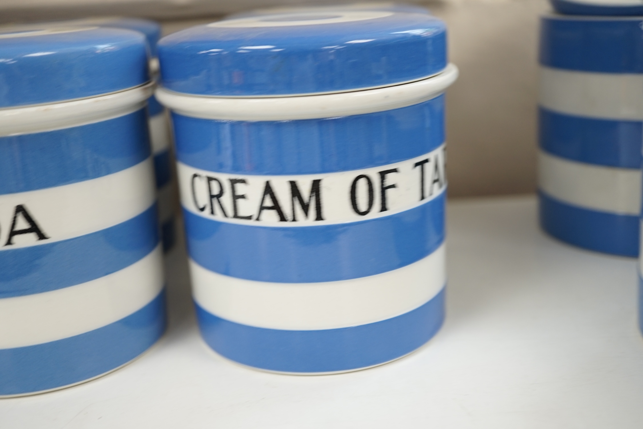 T.G.Green Cornish Kitchenware, nine 10.5cm lidded storage jars to include China Tea, Pearl Barley, Spice, Currants and Ground Almonds, mainly Black Shield marks. Condition - fair to good